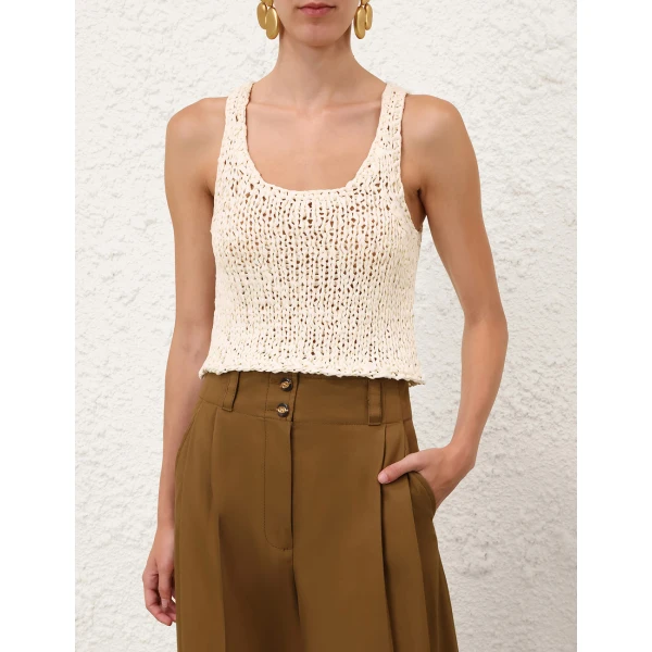 Elevate your elegance in this Zimmermann Tops available now at Coveti