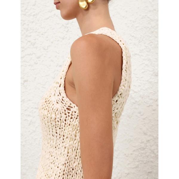 Elevate your elegance in this Zimmermann Tops available now at Coveti