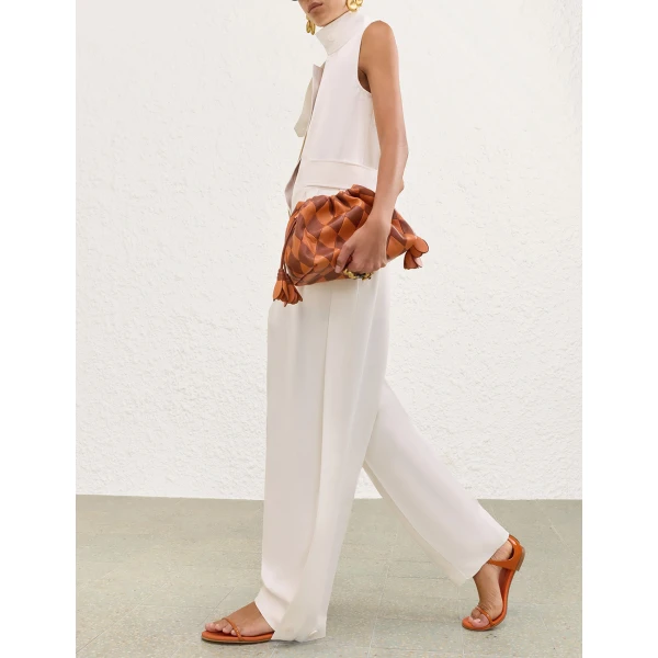 Elevate your elegance in this Zimmermann Jumpsuit available now at Coveti
