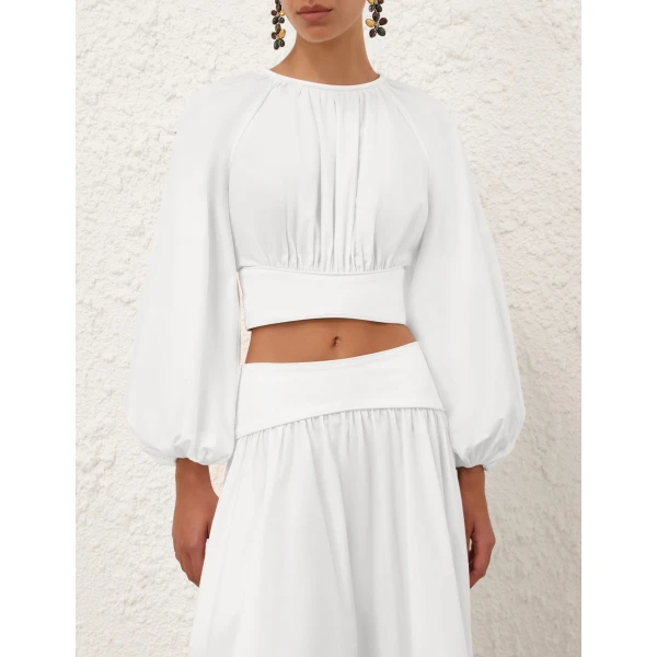 Elevate your elegance in this Zimmermann Tops available now at Coveti