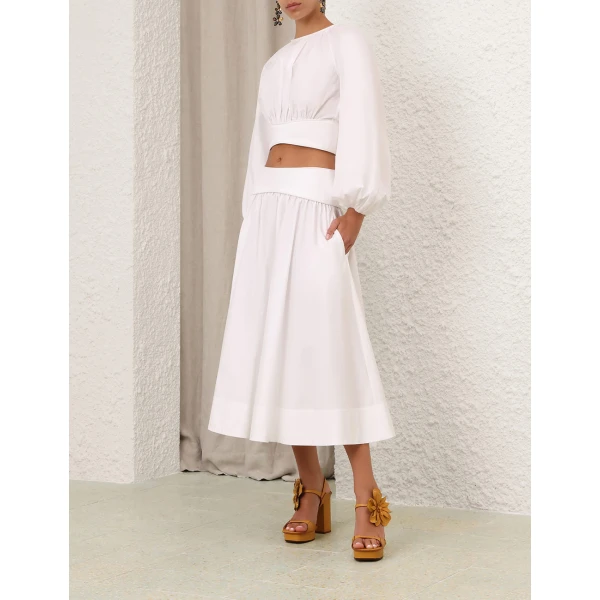 Elevate your elegance in this Zimmermann Tops available now at Coveti