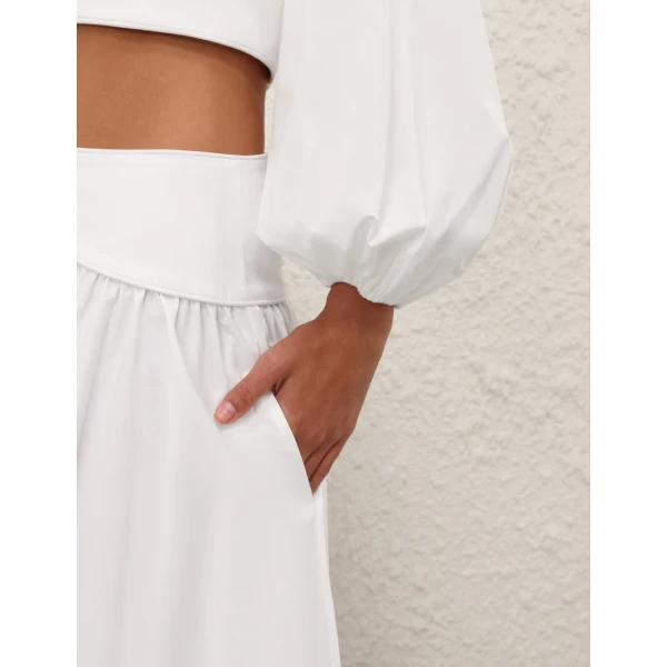 Elevate your elegance in this Zimmermann Tops available now at Coveti