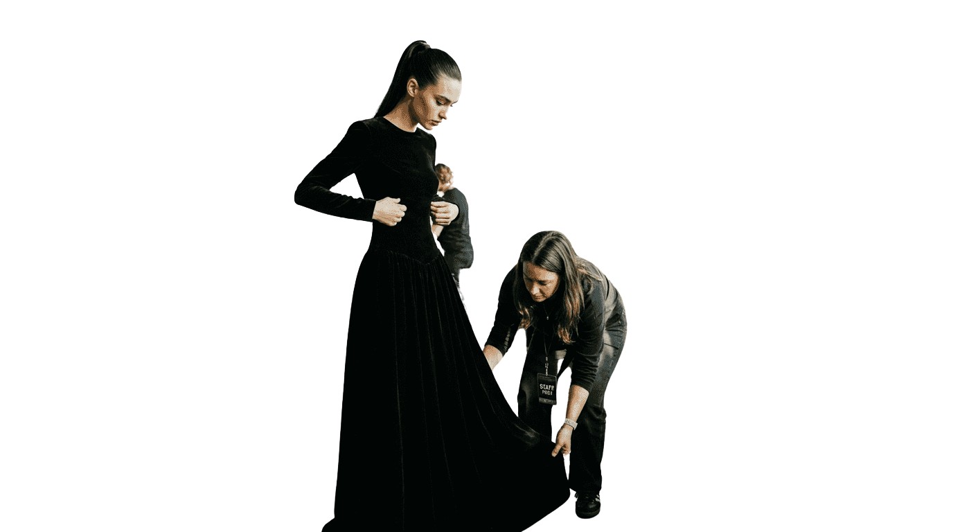 Model and stylist preparing at fashion week backstage