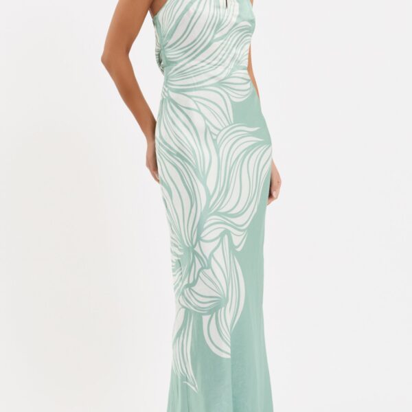 adding a subtle touch of opulence. The bias cut maxi skirt creates a graceful silhouette