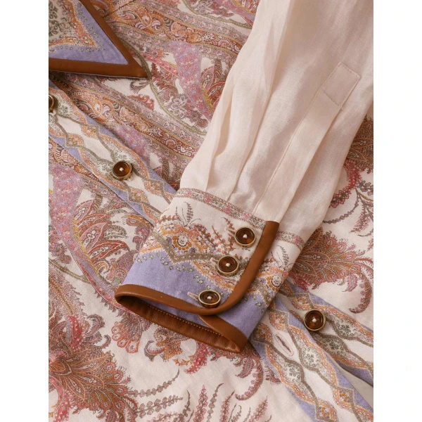 Elevate your elegance in this Zimmermann Tops available now at Coveti