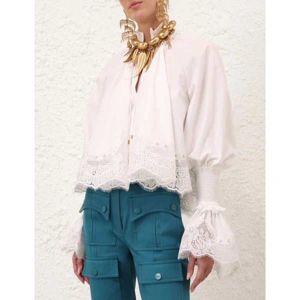 Elevate your elegance in this Zimmermann Tops available now at Coveti