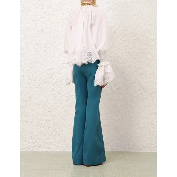 Elevate your elegance in this Zimmermann Tops available now at Coveti