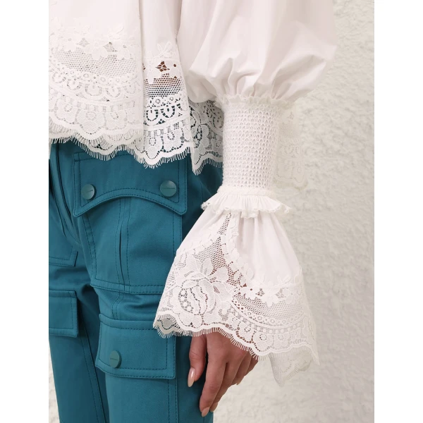 Elevate your elegance in this Zimmermann Tops available now at Coveti