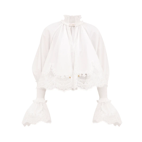 Elevate your elegance in this Zimmermann Tops available now at Coveti