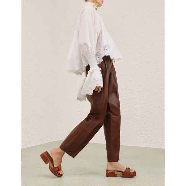 Elevate your elegance in this Zimmermann Tops available now at Coveti