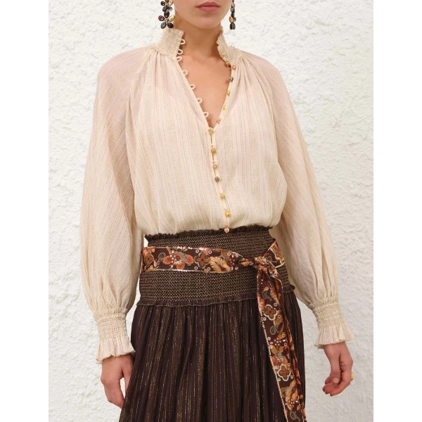 Elevate your elegance in this Zimmermann Tops available now at Coveti