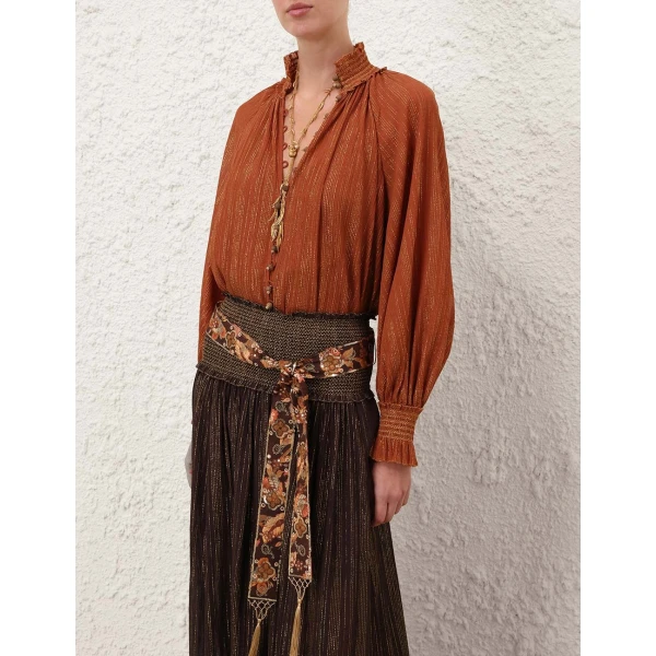 Elevate your elegance in this Zimmermann Tops available now at Coveti