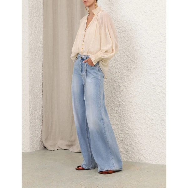 Elevate your elegance in this Zimmermann Tops available now at Coveti