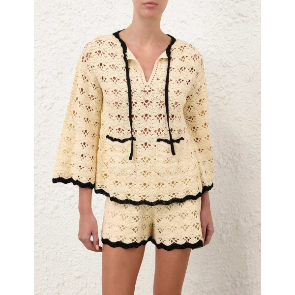Elevate your elegance in this Zimmermann Tops available now at Coveti