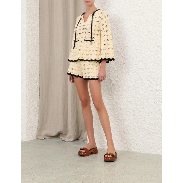 Elevate your elegance in this Zimmermann Tops available now at Coveti