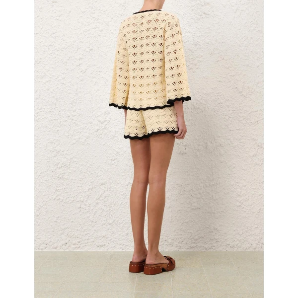 Elevate your elegance in this Zimmermann Tops available now at Coveti