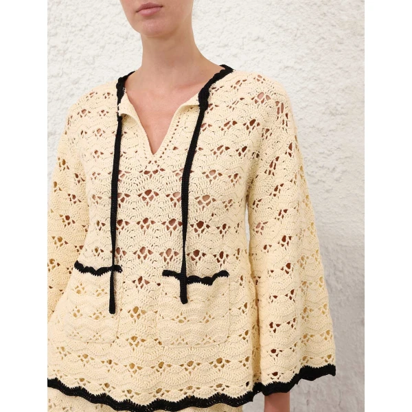 Elevate your elegance in this Zimmermann Tops available now at Coveti