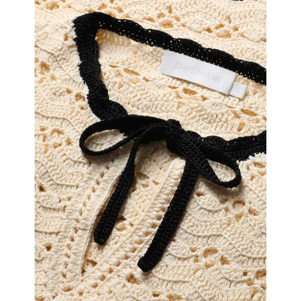 Elevate your elegance in this Zimmermann Tops available now at Coveti