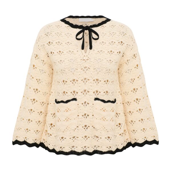 Elevate your elegance in this Zimmermann Tops available now at Coveti