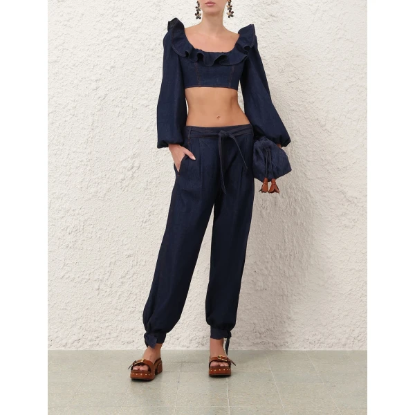 Elevate your elegance in this Zimmermann Tops available now at Coveti