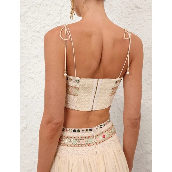 Elevate your elegance in this Zimmermann Tops available now at Coveti