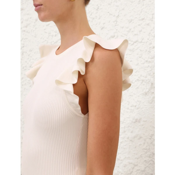 Elevate your elegance in this Zimmermann Tops available now at Coveti