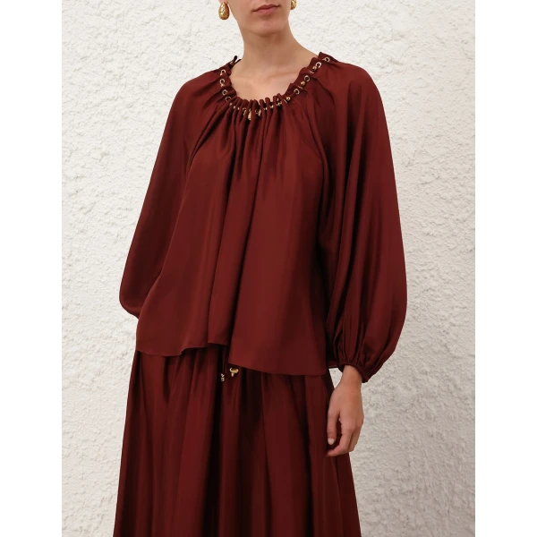 Elevate your elegance in this Zimmermann Tops available now at Coveti