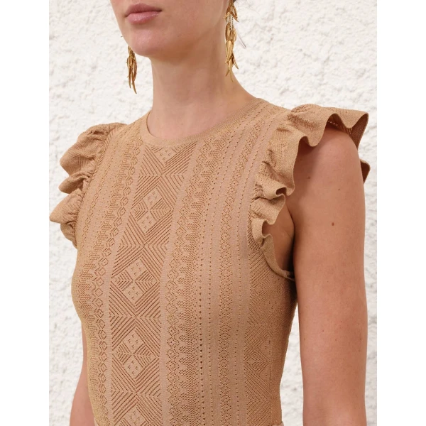 Elevate your elegance in this Zimmermann Tops available now at Coveti