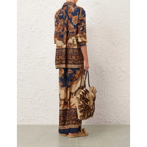 Elevate your elegance in this Zimmermann Tops available now at Coveti