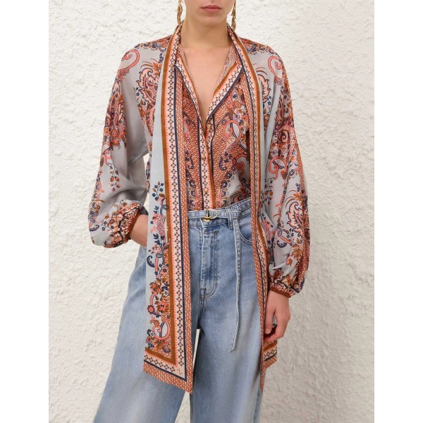 Elevate your elegance in this Zimmermann Tops available now at Coveti