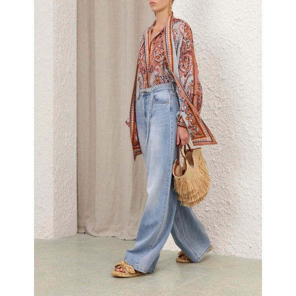 Elevate your elegance in this Zimmermann Tops available now at Coveti