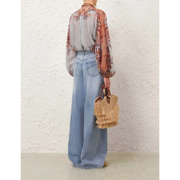 Elevate your elegance in this Zimmermann Tops available now at Coveti