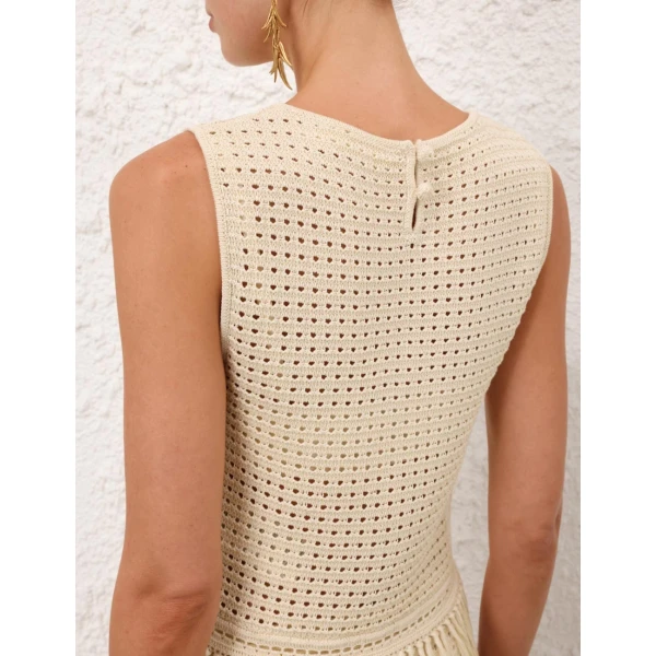 Elevate your elegance in this Zimmermann Tops available now at Coveti