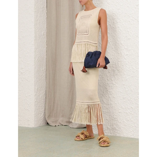 Elevate your elegance in this Zimmermann Tops available now at Coveti