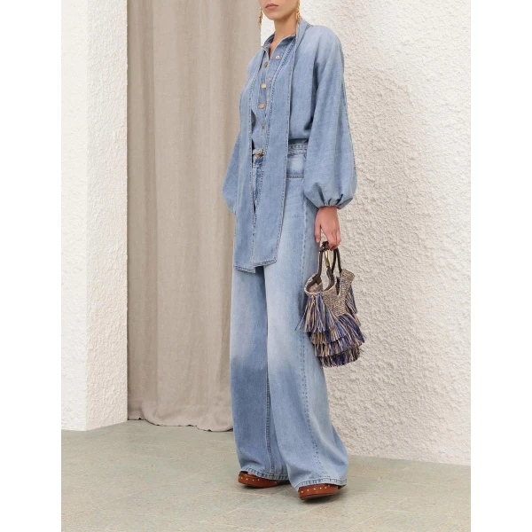 Elevate your elegance in this Zimmermann Tops available now at Coveti