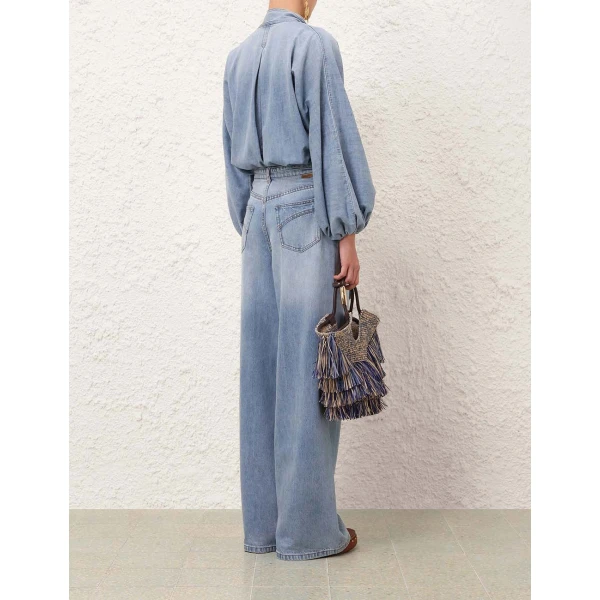 Elevate your elegance in this Zimmermann Tops available now at Coveti