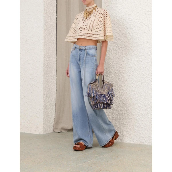 Elevate your elegance in this Zimmermann Tops available now at Coveti