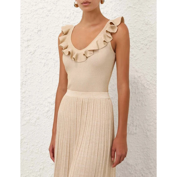 Elevate your elegance in this Zimmermann Tops available now at Coveti