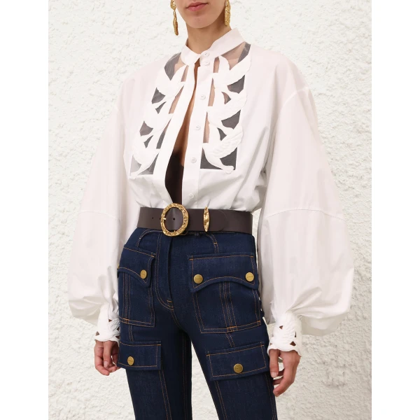 Elevate your elegance in this Zimmermann Tops available now at Coveti