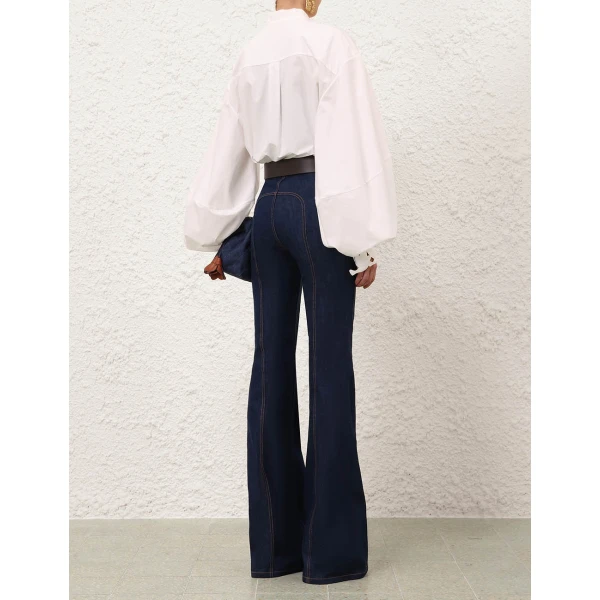 Elevate your elegance in this Zimmermann Tops available now at Coveti