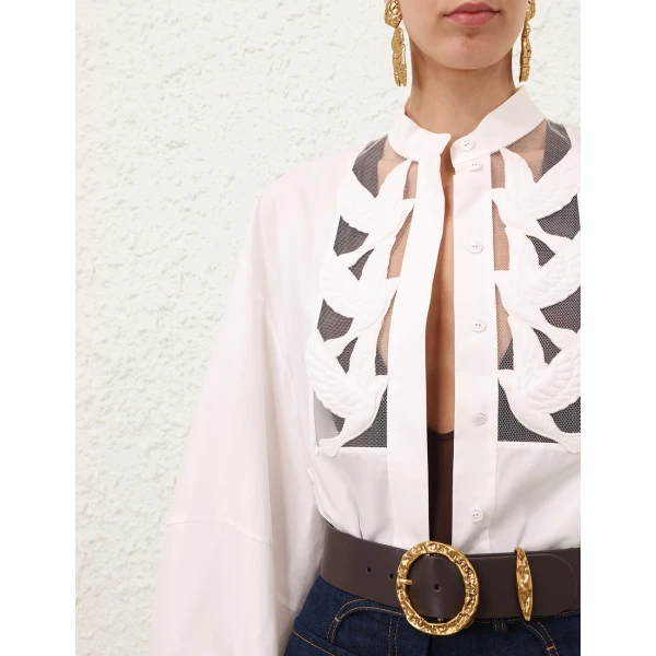 Elevate your elegance in this Zimmermann Tops available now at Coveti