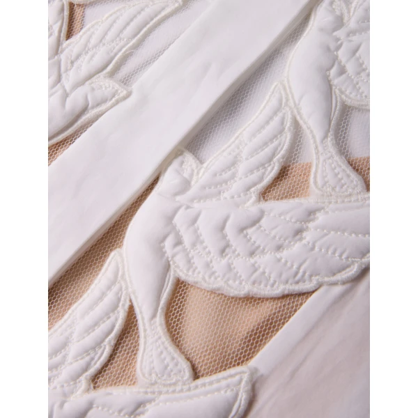 Elevate your elegance in this Zimmermann Tops available now at Coveti