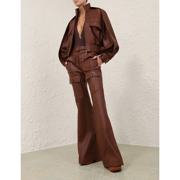Elevate your elegance in this Zimmermann Bodysuit available now at Coveti