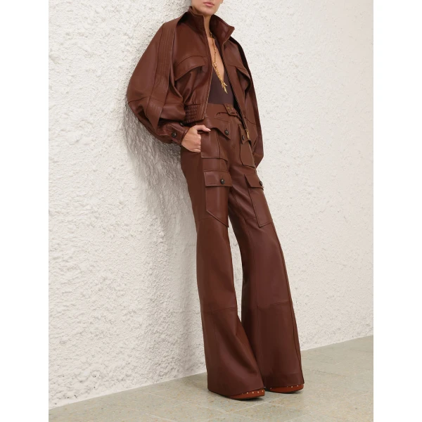 Elevate your elegance in this Zimmermann Bodysuit available now at Coveti