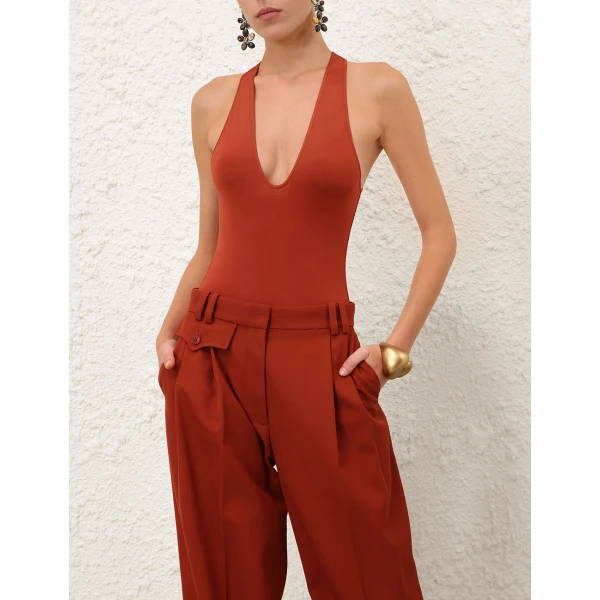 Elevate your elegance in this Zimmermann Bodysuit available now at Coveti