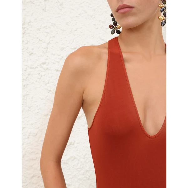 Elevate your elegance in this Zimmermann Bodysuit available now at Coveti