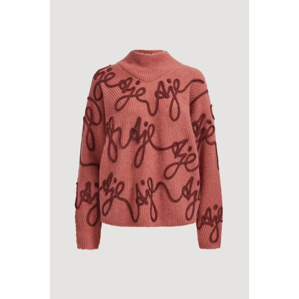 Aje clothing Aus Knitwear – structured silhouette with raw femininity from Coveti