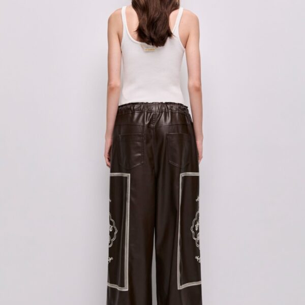 Aje Aus Pants – structured silhouette with raw femininity from Coveti