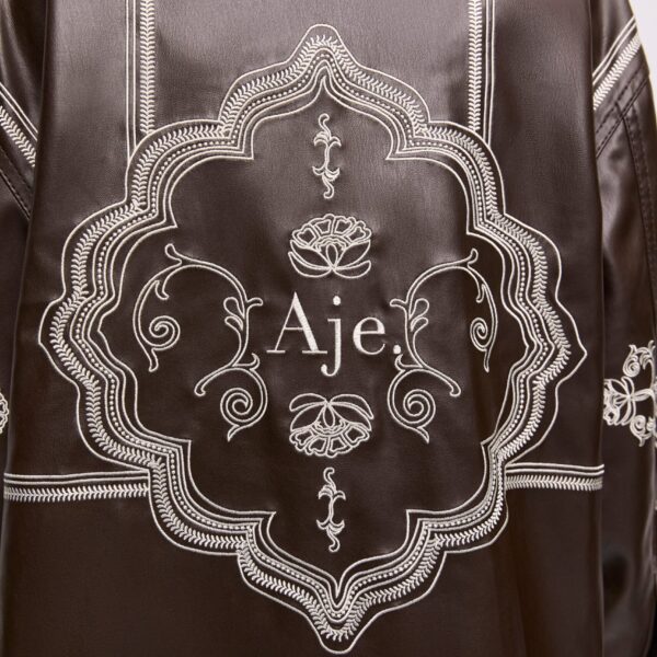 Aje Aus Tops – structured silhouette with raw femininity from Coveti