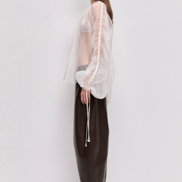 Aje Aus Tops – structured silhouette with raw femininity from Coveti